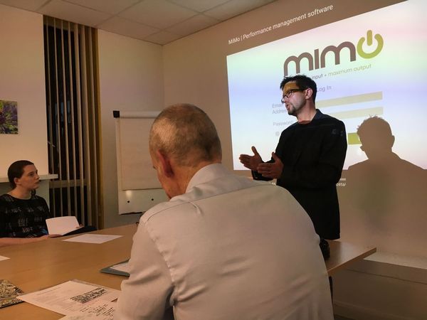 Close up of presenter talking to people